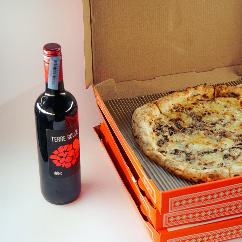 A Funghi E Parmigiano Pizza & 1 Bottle of Malbec
